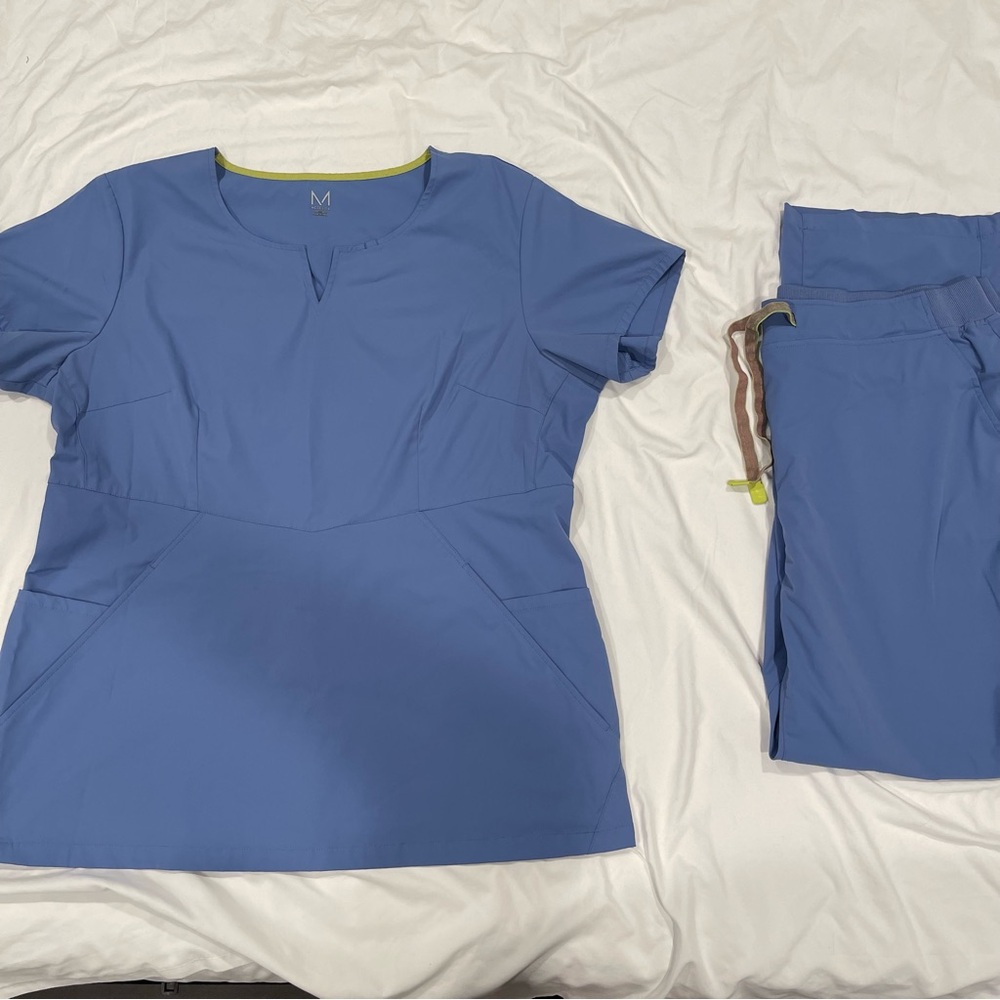 Blue Medelita scrub top and pants in a size XL.